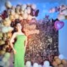 Golden chrome balloons and elegant white latex balloons dance in the air, creating an atmosphere of pure delight.