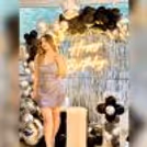 Dive into the charm of a chic birthday affair with a captivating Black and Silver Balloon Arch Backdrop, creating a visually striking atmosphere.