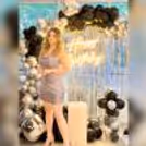 The Transparent Cake Table is showcased amidst a backdrop of Silver Frill Curtains, capturing the essence of a glamorous birthday setup.