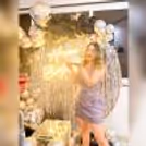 Joyous smiles and shared memories are beautifully framed against the Black and Silver Balloon Backdrop, creating a memorable and stylish birthday experience.