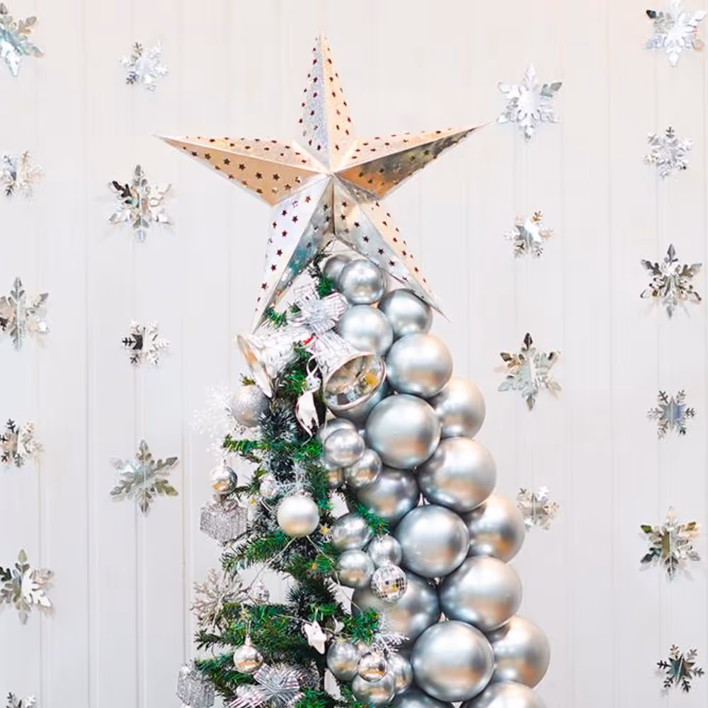 It's also charmed with silver bells atop the tree, all tied together with a silver bow and a delightful assortment of premium ornaments.