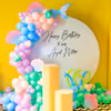 A whimsical birthday setup featuring a ring backdrop.
