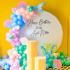 A whimsical birthday setup featuring a ring backdrop.
