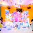 Our princess-themed decor features a captivating castle backdrop adorned with pastel balloons, creating an enchanting arch.