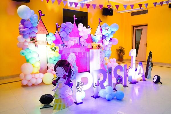 There are enchanting princess sunboard cutouts, bespoke name cutouts, and a regal cake table in our princess-themed setup.