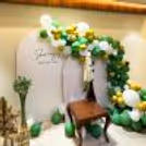 White Macron Balloons and Charming Lamps with Pampas Grass Sticks, all crafted to Add Charm To The Celebration.