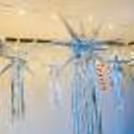 Delicate snowflakes, Candy Cane Sticks, and Silver Glitter Balls suspended in a breathtaking display, adding a unique charm to