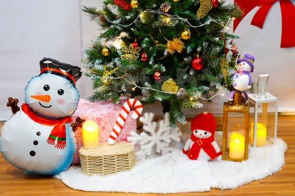 Premium Wreath, Assorted Ornaments, and festive Candy Canes in the Jingle Bell Entrance Decor.