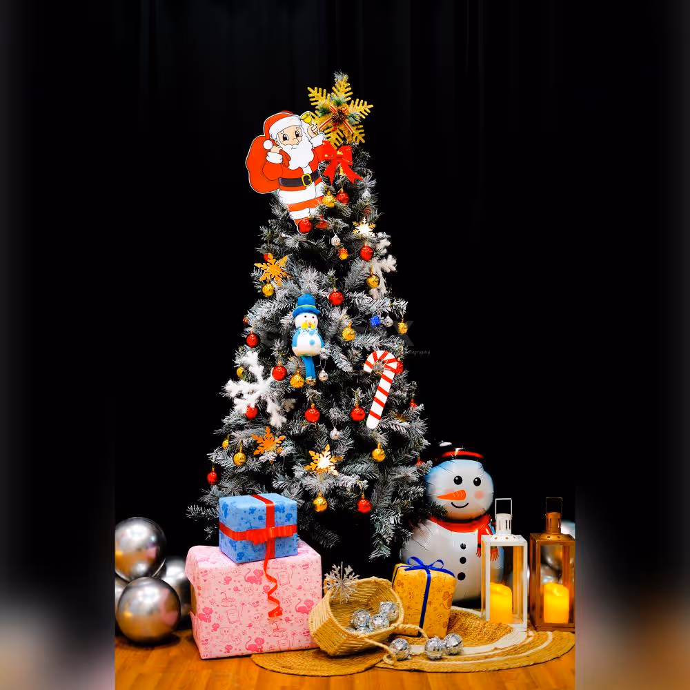 A radiant 6 Ft white European Christmas tree adorned with golden snowflakes and bow entrance hangings.