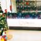 Christmas decor, featuring a 6-ft tree adorned with gift boxes, twinkling snow LED lights,