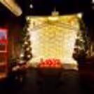 Step into a dreamy cabana adorned with drapes and soft lights for an enchanting movie night experience.