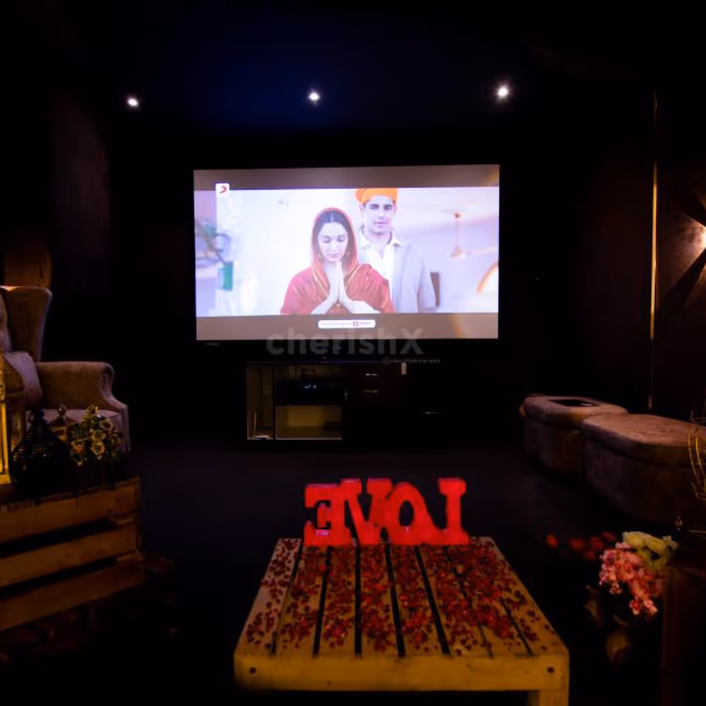 A romantic cabana setup with garlands, lights, and Love LED letters, creating a cosy atmosphere for your special night.