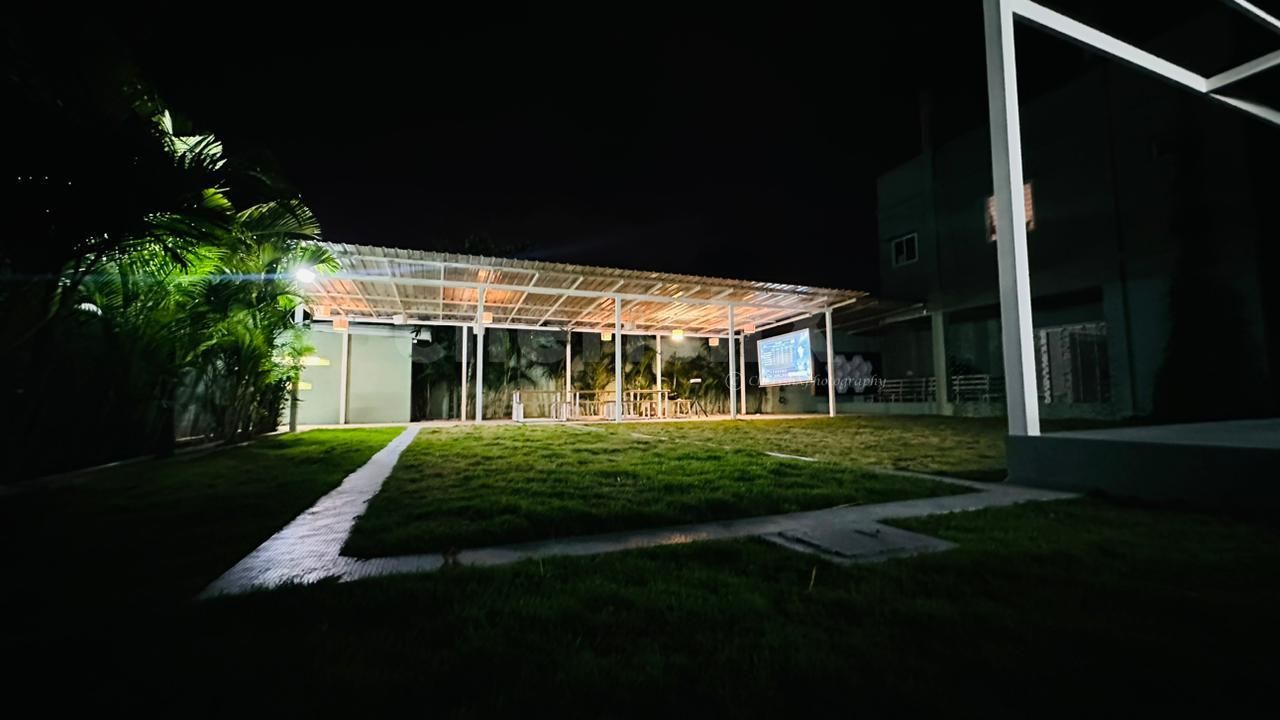 A neon light with a special occasion message, surrounded by ambient lights, adding a personalized touch to the enchanting decor.