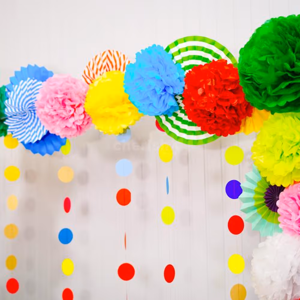 A beautiful arrangement of rosettes, pom-poms, and lanterns for a stunning Dusshera pooja decor.
