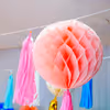 An array of rosettes and pom poms in lively colours, add to the festive ambience.