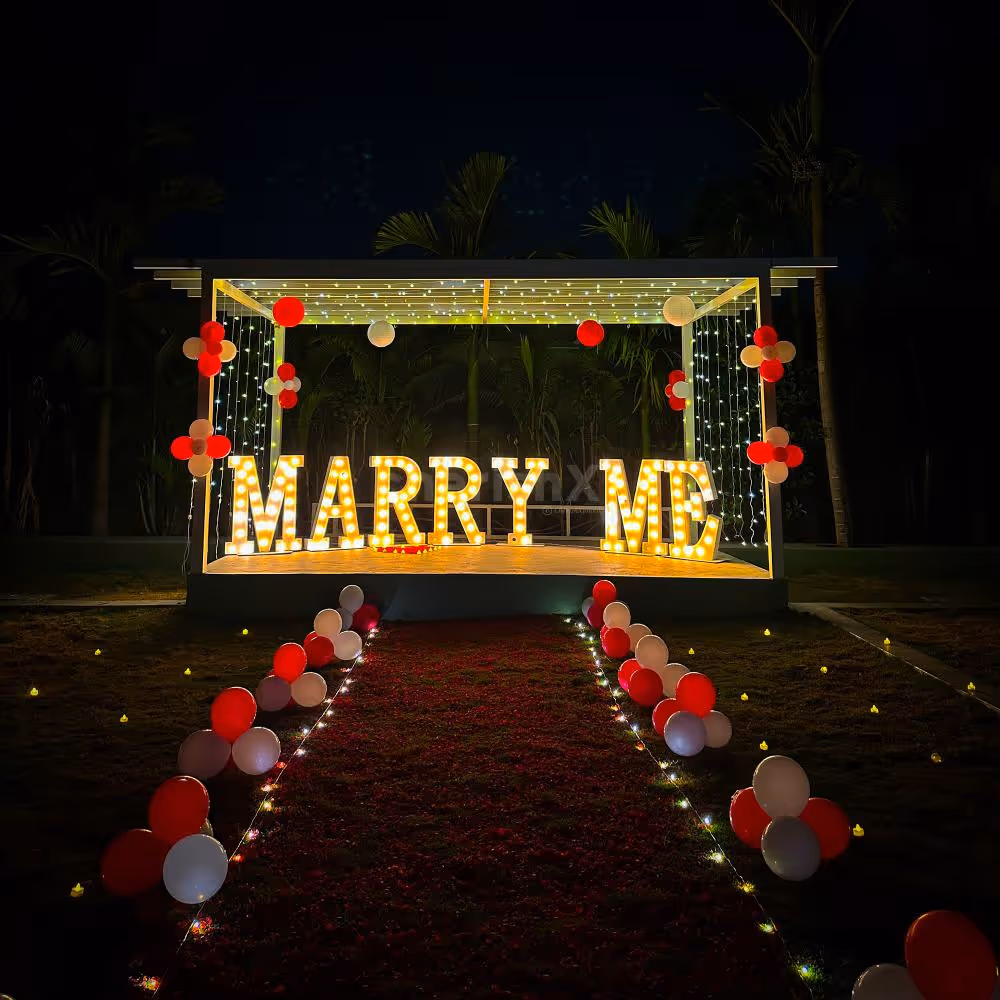 The dreamy set-up is enchanting and features LED "M.A.R.R.Y. M.E." letters