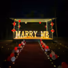 The dreamy set-up is enchanting and features LED "M.A.R.R.Y. M.E." letters