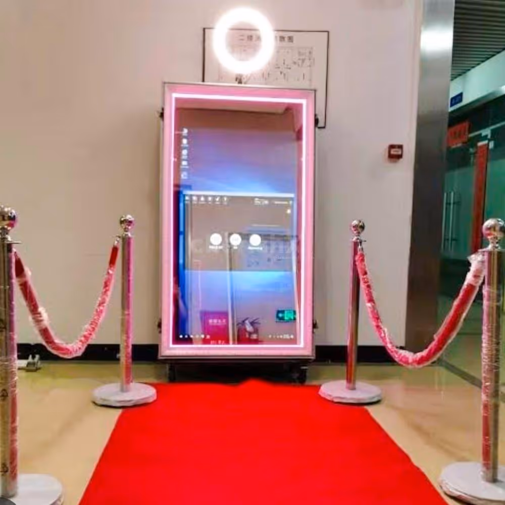 Enchanting Magic Mirror Instant Photobooth setup with a 7 ft tall mirror and a red carpet for an exclusive feel.