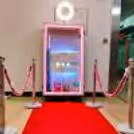 Enchanting Magic Mirror Instant Photobooth setup with a 7 ft tall mirror and a red carpet for an exclusive feel.