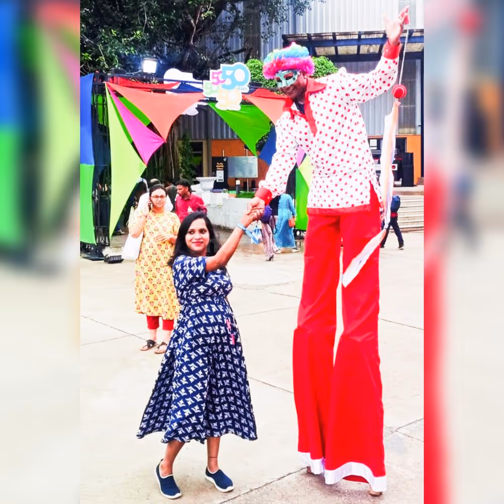 stilt walkers with 11 ft tall performers in charming clown costumes