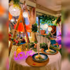 Elegant table setting adorned with sumptuous meals, creating a whimsical and romantic atmosphere at Love Garden, Jaipur.