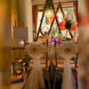 Captivating view of Love Garden's enchanting decor, featuring elegant table arrangements and a warm, intimate atmosphere.