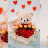 A cuddly teddy bear nestled in the hamper, promising comfort and warmth for your loved one.