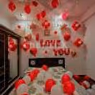 Romantic red-themed "Love You" balloon decor, perfect for proposals, anniversaries, and Valentine's Day.