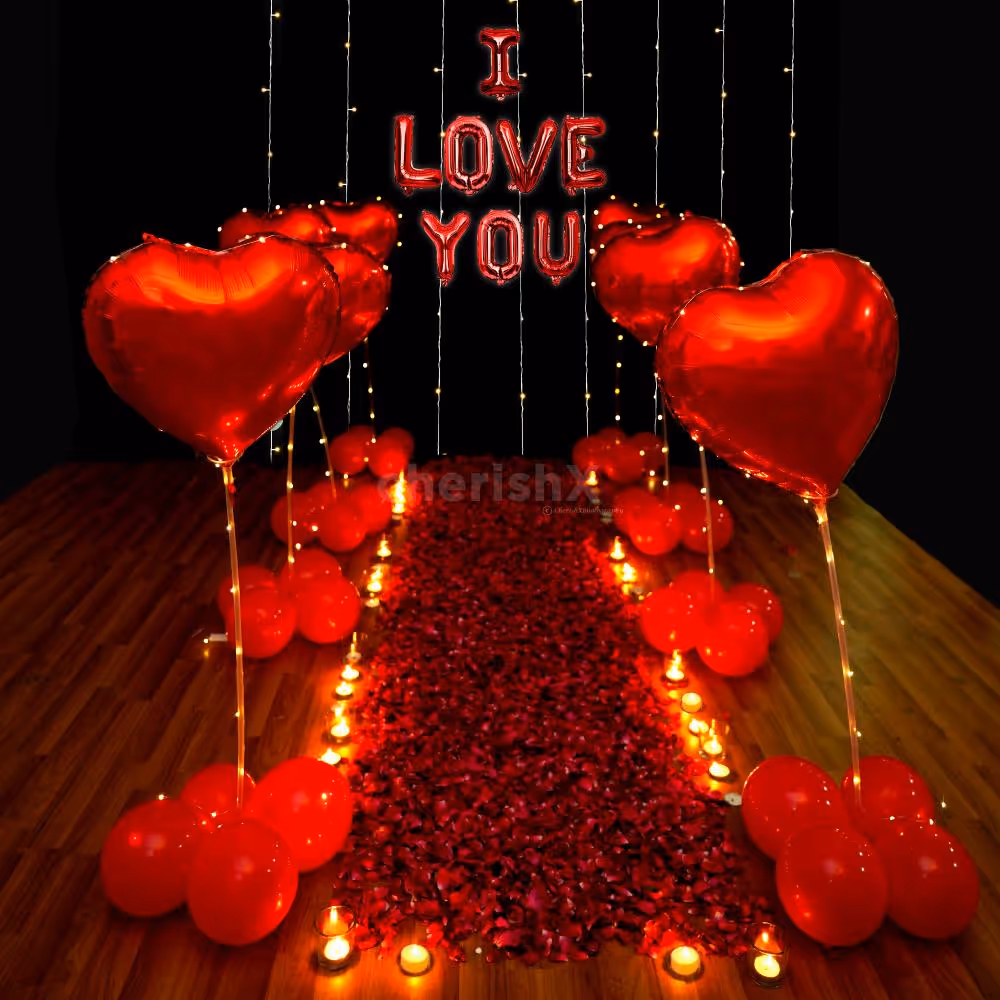A romantic Valentine decor adorned with Rose Petals, Red Heart Balloons, and Lights