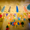 Multicoloured flag buntings are a lively addition to festive decor.