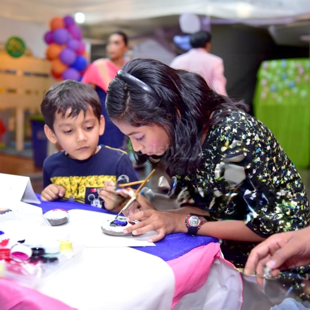 Pebble Stone Painting captivates young hearts with a rainbow of designs, leaving behind memories to treasure.