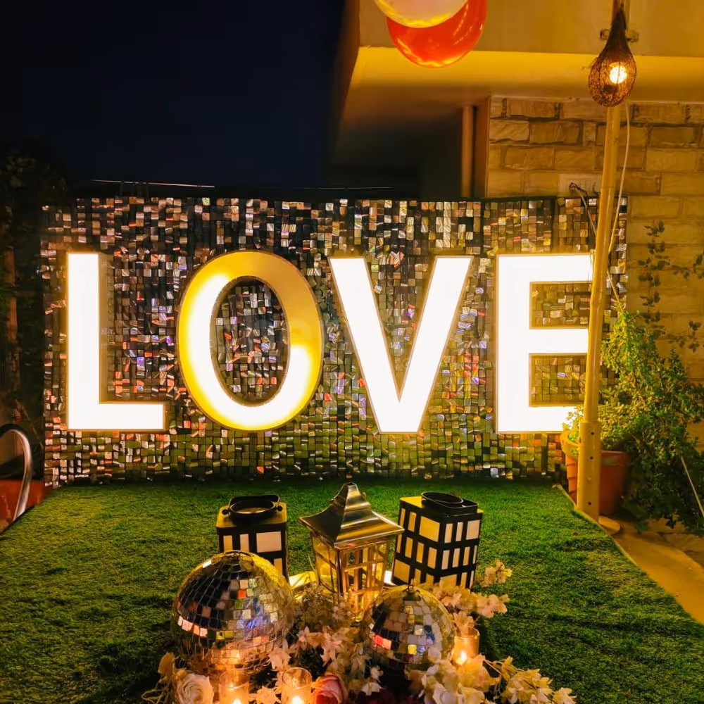 Illuminate your love story with neon declarations under the twilight sky.