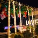 Indulge in the exotic allure of poolside romance, where every detail whispers of love.