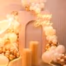 Illuminate your celebration with butterflies, balloons, and neon lights.