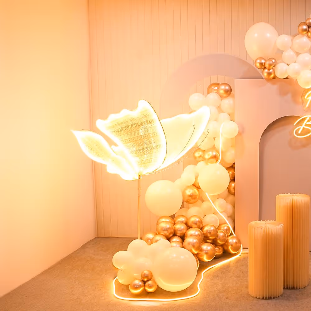 Every detail sparkles with joy in our butterfly and neon light decor