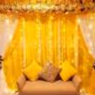 Stunning backdrop decor featuring high-quality artificial flowers and charming hanging props.
