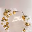 Beautiful CherishX anniversary setup featuring a luxury balloon ring, acrylic balloon box, and elegant floral detailing.