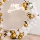 Celebrate love with this premium CherishX anniversary decoration in white, gold, and soft floral tones.