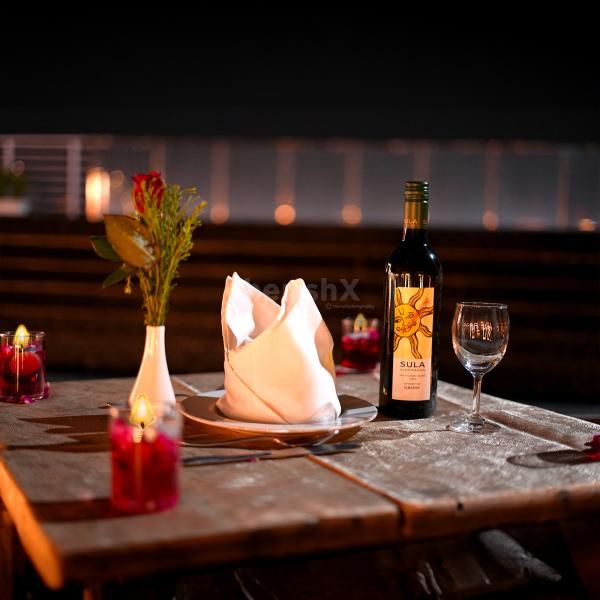 "Create cherished memories with our poolside candlelight dinner experience."