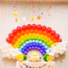 Whimsical rainbow swirls and characters for a magical ceiling decoration