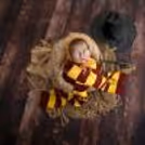 Charming Delight: Baby’s joyful expression in a beautifully styled scene.