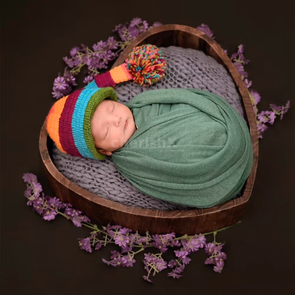 Charming Delight: Baby’s joyful expression in a beautifully styled scene.