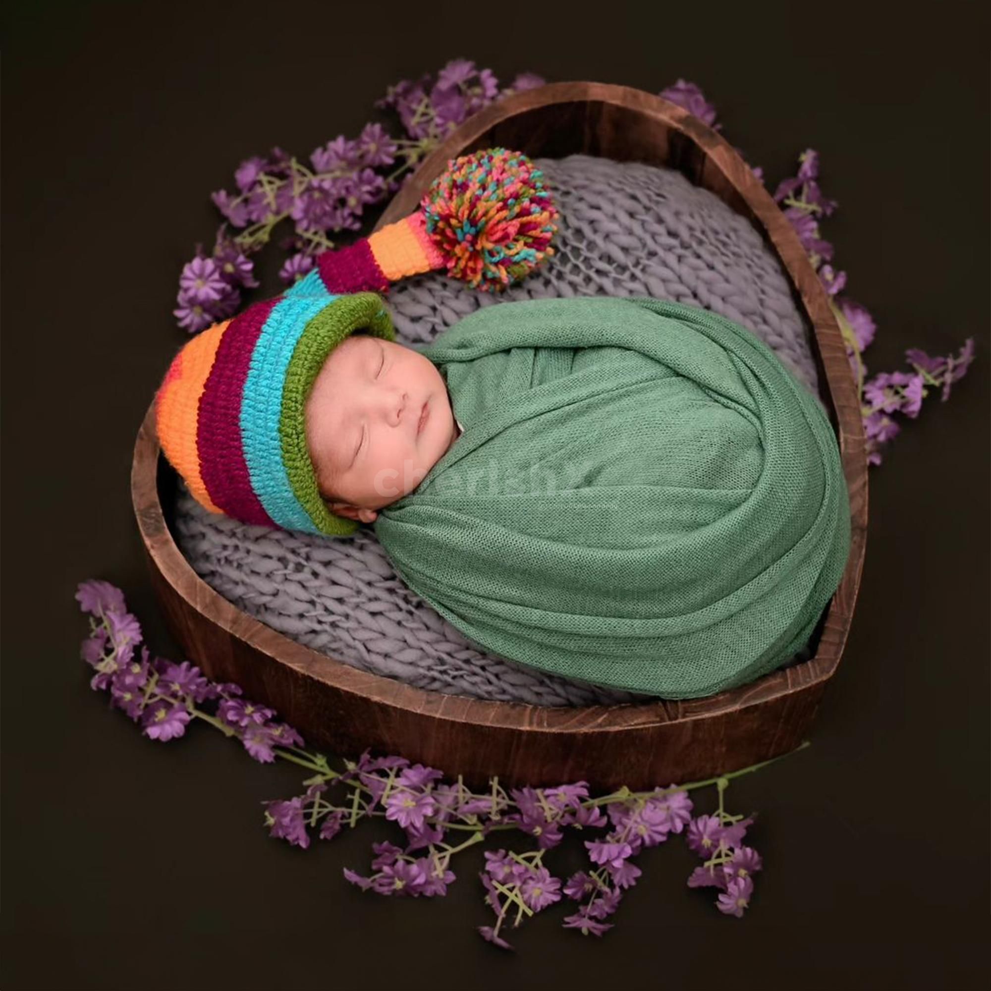 Charming Delight: Baby’s joyful expression in a beautifully styled scene.