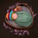 Charming Delight: Baby’s joyful expression in a beautifully styled scene.