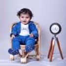 Charming Delight: Baby’s joyful expression in a beautifully styled scene