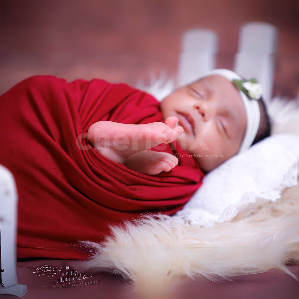 Charming Delight: Baby’s joyful expression in a beautifully styled scene