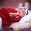 Charming Delight: Baby’s joyful expression in a beautifully styled scene