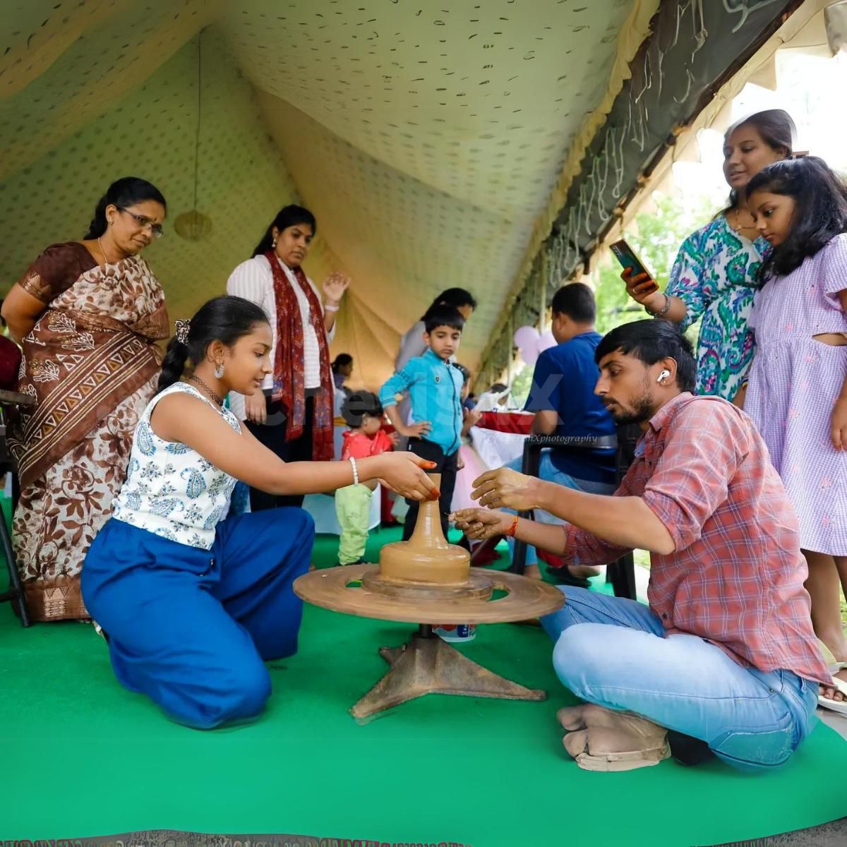 Tiny hands, big creations during the pottery activity at the kids' birthday party