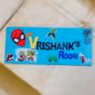 Kids enjoy creating personalized name plates as part of the party activity.