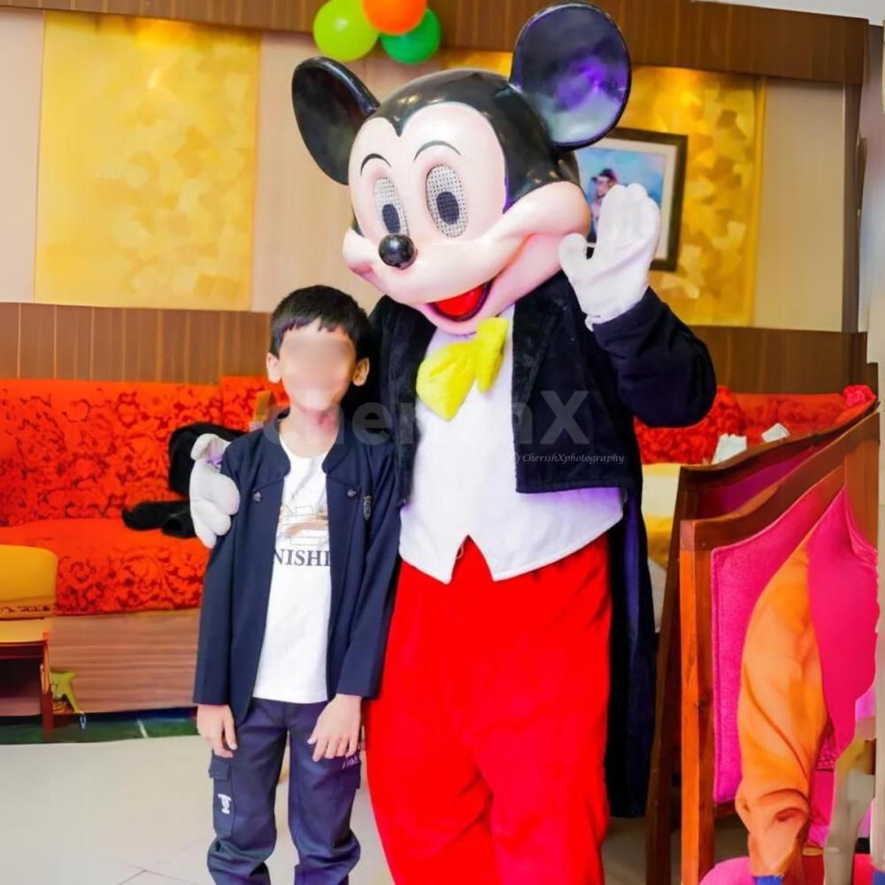 A live Mickey Mouse character bringing classic fun to the birthday party